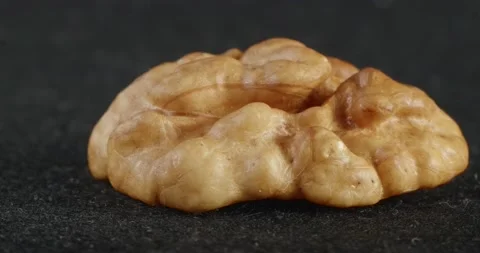 Walnut texture close-up. Macro nut kernels. Stockbeeldmateriaal 165648875