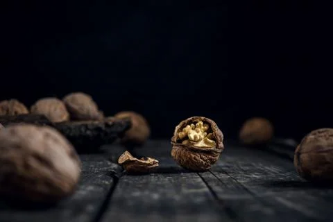 Walnut walnuts on rustic old wooden table Stock Photos