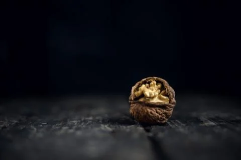 Walnut walnuts on rustic old wooden table Stock Photos
