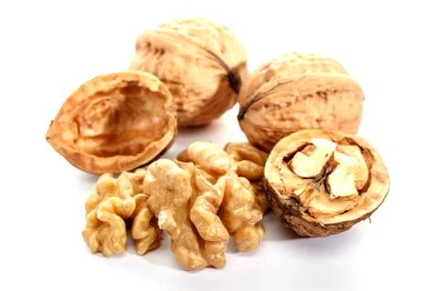Walnut on white background, isolated. Cracked nut. Dietary product. Omega 3. Stock Photos