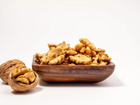 Walnut on a white background. Raw walnut. Stock Photos