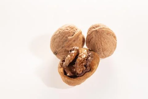 Walnut whole and split isolated on a white background with a close up Stock Photos