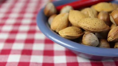 Walnuts, almonds in a bowl Stock Footage 72392611