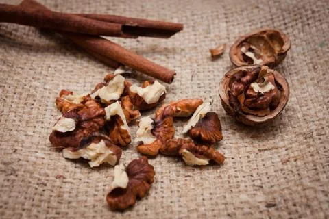 Walnuts and cinnamon. Stock Photos
