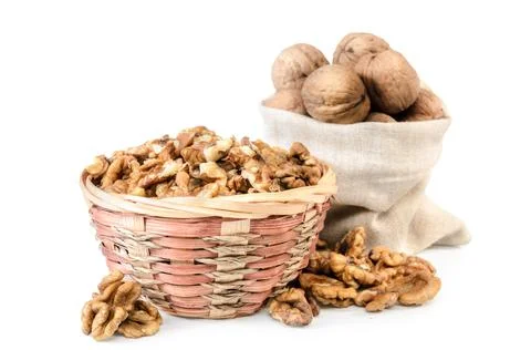 Walnuts and kernels in a bag on a white background with soft shadow Stock Photos