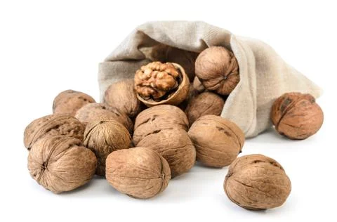 Walnuts and kernels in a bag on a white background with soft shadow Stock Photos