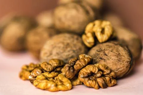 Walnuts and kernels on beige backgound Stock-Fotos
