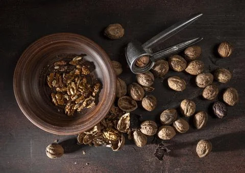 Walnuts and metal nutcracker 写真素材