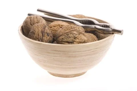 Walnuts and nutcracker Stock Photos