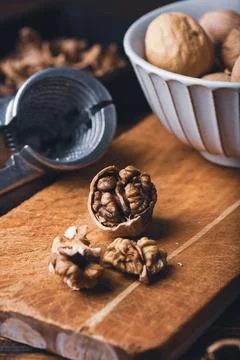 Walnuts and nutcracker Stock Photos