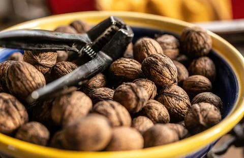 Walnuts and nutcracker Stock Photos