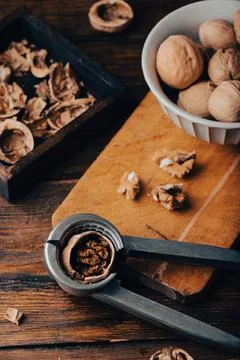 Walnuts and nutcracker Stock Photos
