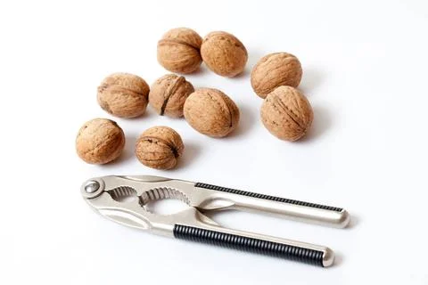 Walnuts and nutcracker walnuts and nutcracker on white background Copyrigh... Stock Photos