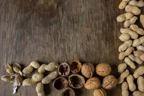 Walnuts and peanuts in a peel Stock Photos