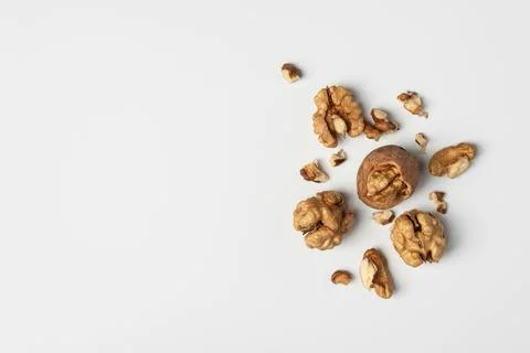 Walnuts and shells on white background. Natural healthy food concept emphasiz Stock Photos