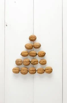Walnuts arranged in a pyramid form Stock Photos
