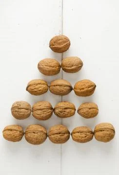 Walnuts arranged in a pyramid shape Stock Photos