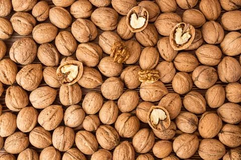 Walnuts background. Walnuts texture. Group walnuts on wooden background. Stock Photos