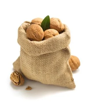 Walnuts in bag on white background Stock Photos