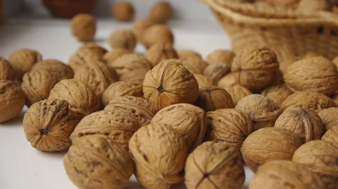 Walnuts In The Basket And On The White Table Closeup Stock Footage 65161124
