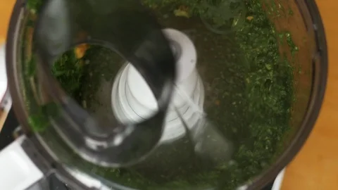 Walnuts being added into food processor Stock Footage 74307295