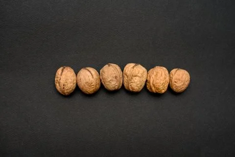 Walnuts on a black background, macro Stock Photos