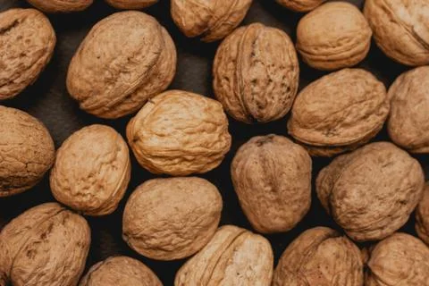 Walnuts on a black background, macro Stock Photos