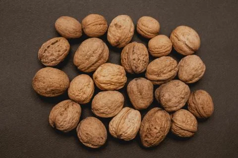 Walnuts on a black background, macro Stock Photos