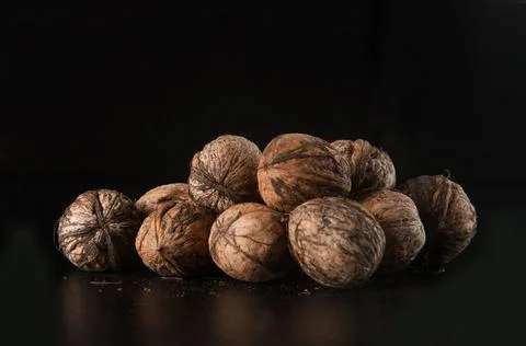 Walnuts on a black background Stock Photos