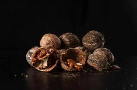 Walnuts on a black background Stock Photos