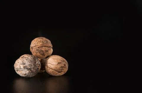Walnuts on a black background Stock Photos
