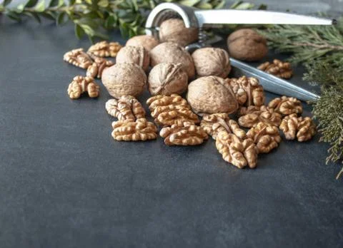 Walnuts on a black background, walnut kernels. Healthy food from walnut. Stock Photos