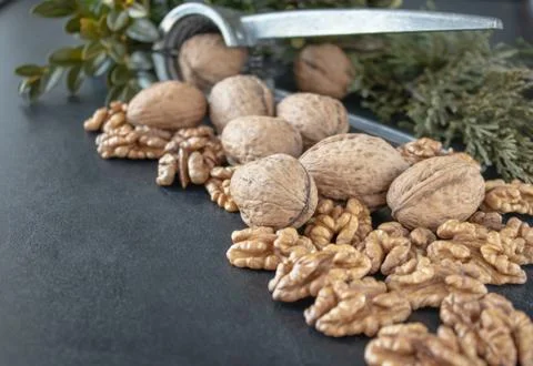 Walnuts on a black background, walnut kernels. Healthy food from walnut. Stock Photos