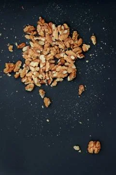 Walnuts on the black background Walnuts kernels on the black background Stockfoto's