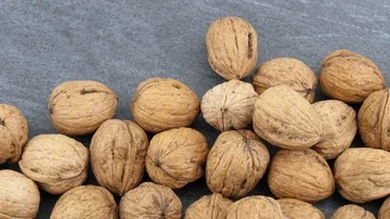 Walnuts on black stone background Stock Footage 85951212