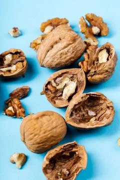 Walnuts on a blue background Stock Photos