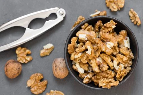 Walnuts in bowl top view Stock Photos