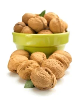Walnuts in bowl on white Stock Photos