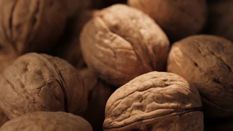 Walnuts. Camera slowly moves up to show walnuts in shadow and on which beam of 库存影片 207953673