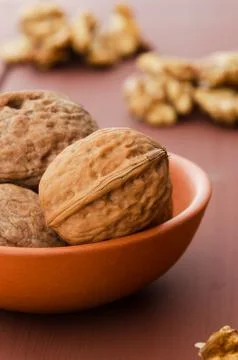 Walnuts in ceramic bowl Stock Photos
