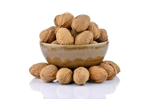 Walnuts in a ceramic bowl Stock Photos
