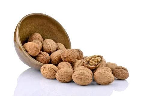 Walnuts with a ceramic bowl Stock Photos