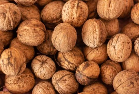 Walnuts close up background, top view natural food texture Stock Photos