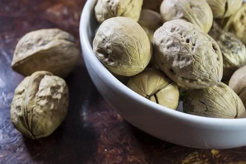 Walnuts close up, not peeled walnuts. Stock Photos
