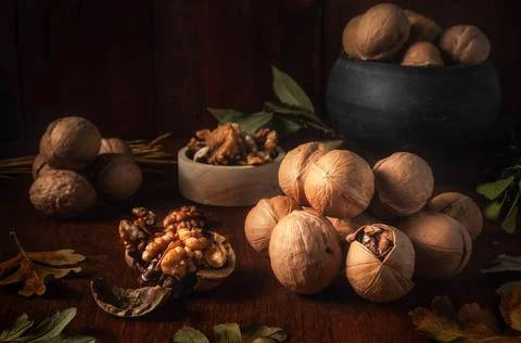 Walnuts on a dark background in a rustic style Stock Photos