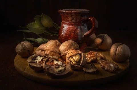 Walnuts on a dark background in a rustic style Stock Photos