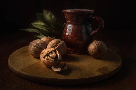 Walnuts on a dark background in a rustic style Stock Photos