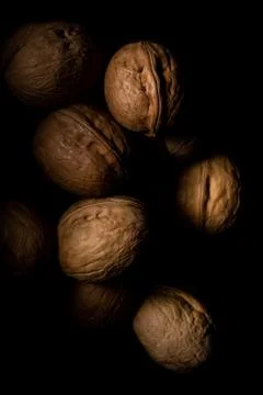 Walnuts on dark background with shadows Stock Photos