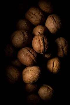 Walnuts on dark background with shadows Stock Photos