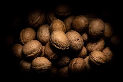 Walnuts on dark background with shadows Stock Photos